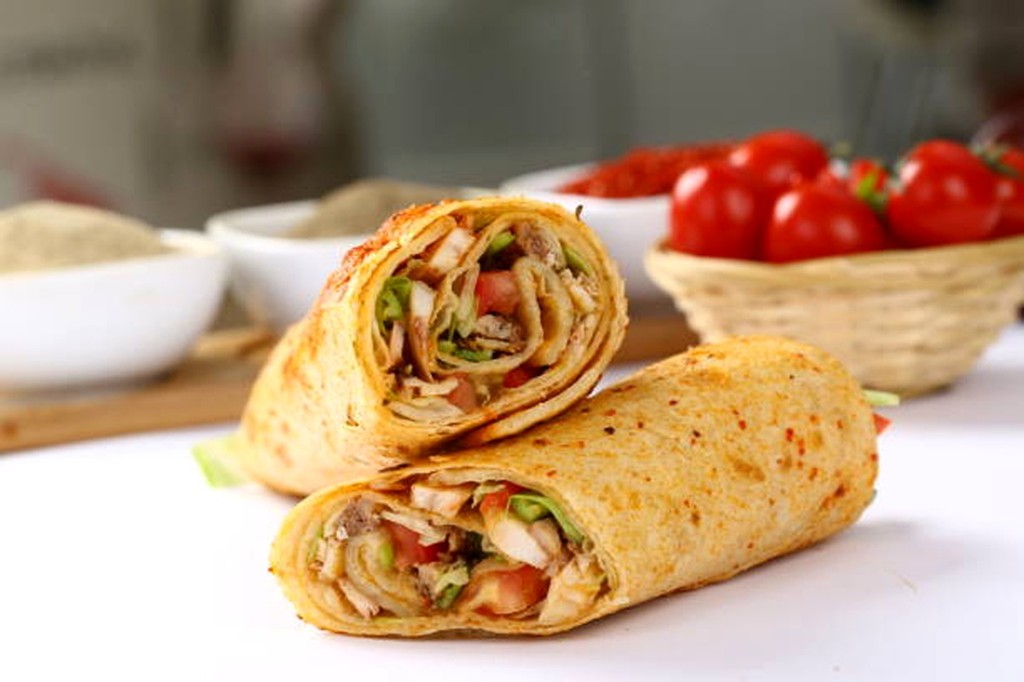 Pork burrito wrap cut in half